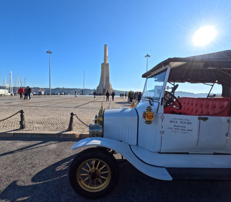 A vintage tuktuk by the Monument to the Discoveries